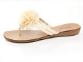 Sandalias planas con flor, en amarillo (lateral)