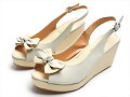 Sandalias cu&ntilde;a boca pescado, con lacito, en blanco