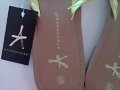 Sandalias de ba&ntilde;o, de dedo, en amarillo (detalle)