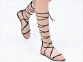 Sandalias planas de tiras de centuri&oacute;n en negro