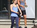 Claire Holt y su hermano Alex saliendo de gym 2014