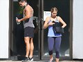 Claire Holt y su hermano Alex saliendo de gym 2014